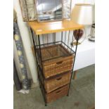 A modern beech and metal work effect storage unit having three wicker drawers