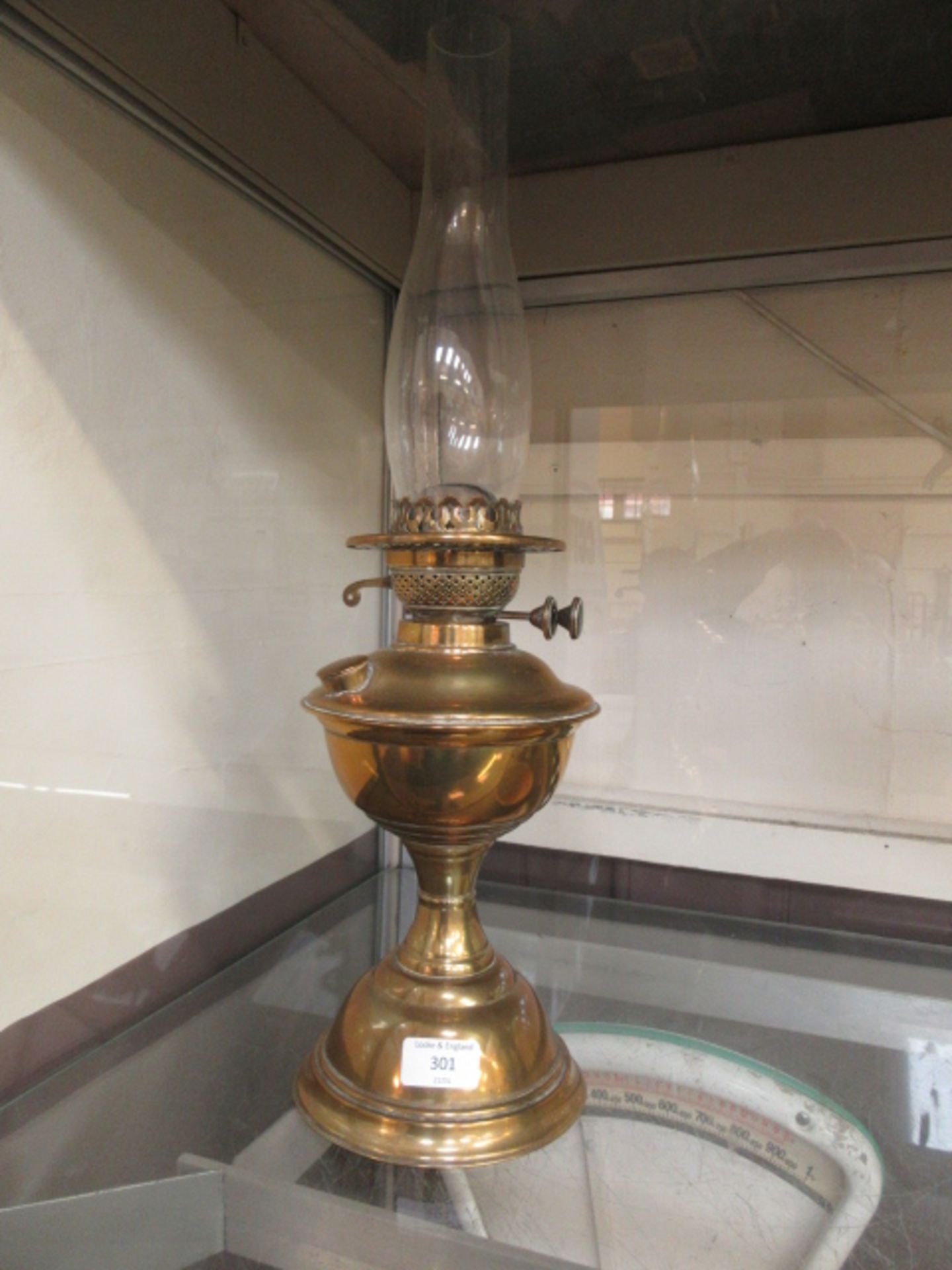 An early 20th century brass oil lamp