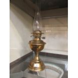 An early 20th century brass oil lamp