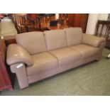 A light brown leather three seat sofa