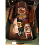 A tray containing an oak cased mantle clock two cars, cigarette card album, leather wallet,