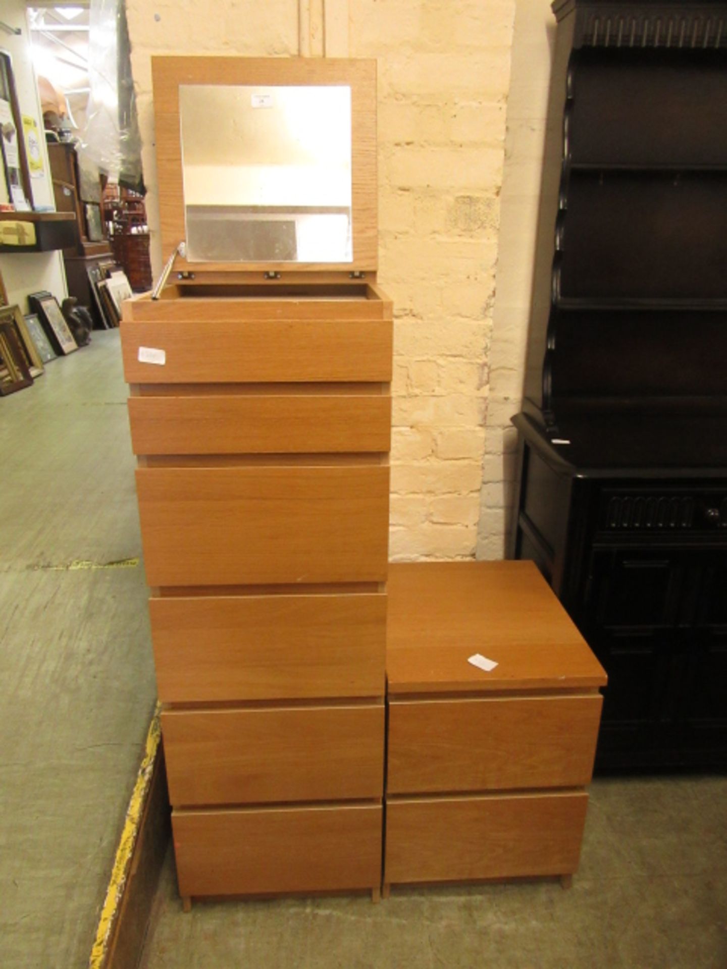 A modern oak veneered chest of six drawers with mirror to top along with a matching bedside chest