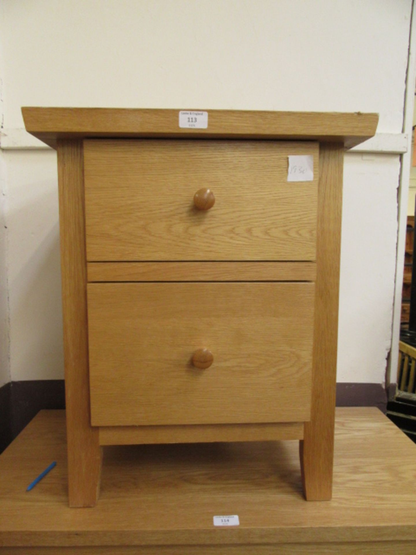 A modern two drawer bedside chest