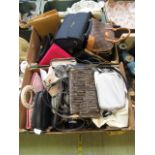 Two trays containing a large quantity of ladies handbags