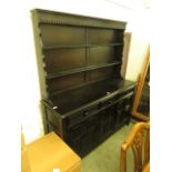 A dark elm dresser,