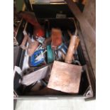 A tray containing an assortment of hand tools to include planes, G clamps, flat iron etc.