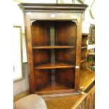 A reproduction oak corner wall mounted open cabinet.