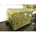 An embossed brass coal box