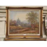 A gilt framed oil on canvas of countryside scene signed T Wood