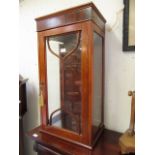 A reproduction mahogany and inlaid glazed display cabinet with two adjustable glass shelves