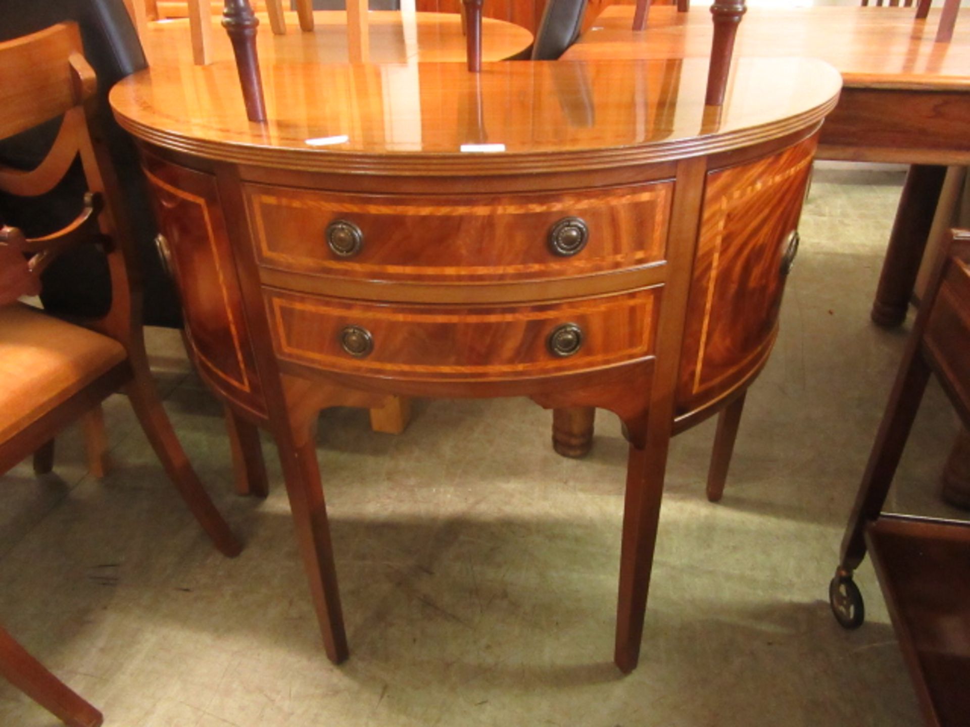 A reproduction mahogany demi lune sideboard,