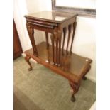 A nest of three burr walnut topped occasional tables along with a matching coffee table