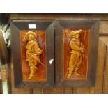 A pair of oak framed 19th century tiles depicting cavaliers