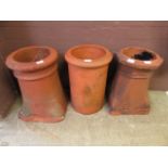 Three terracotta chimney pots