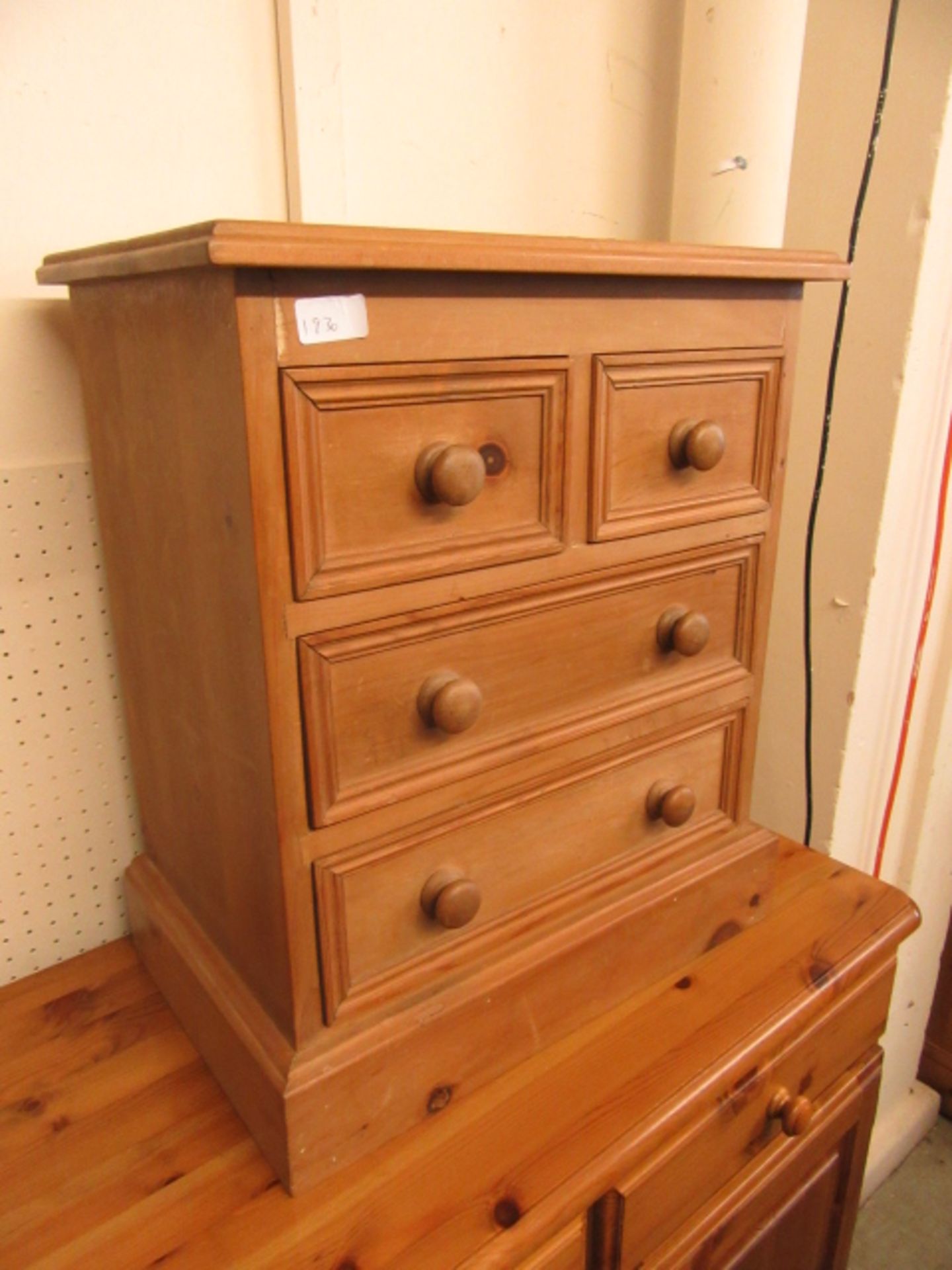 A pine bedside chest of two short over two long drawers