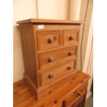 A pine bedside chest of two short over two long drawers