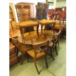 A reproduction mahogany single pedestal dining table along with a set of six (4+2) dining chairs