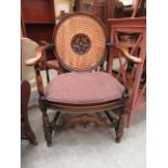 A reproduction beech open armchair,