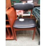 A mid twentieth century design teak dining chair upholstered in a black vinyl fabric (possibly by