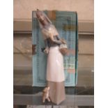 A boxed Lladro figure of a young lady with puppy and basket