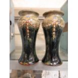 A pair of green glazed Royal Doulton vases