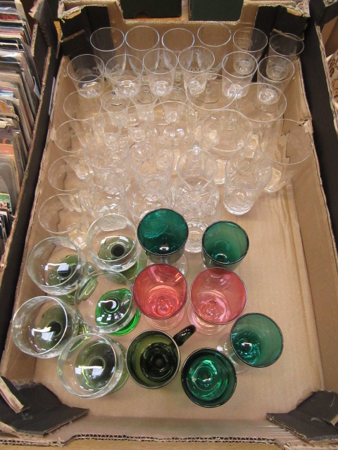 A tray containing an assortment of glassware to include cranberry, etched glassware etc.