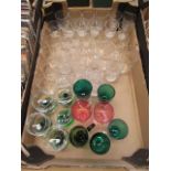 A tray containing an assortment of glassware to include cranberry, etched glassware etc.