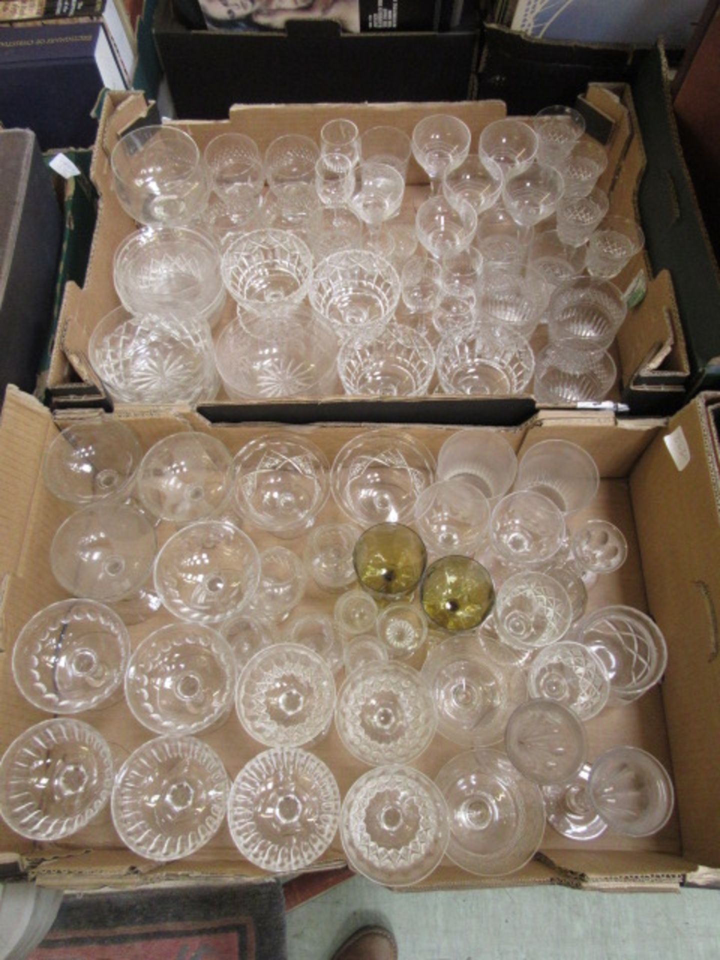 Two trays of glass drinking vessels