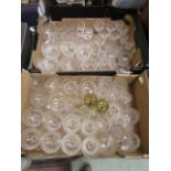 Two trays of glass drinking vessels