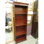 A modern mahogany open bookcase with adjustable shelving