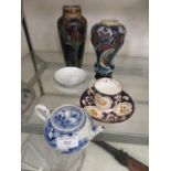 An oriental blue and white tea pot together with cups, saucer, two Dutch vases etc.