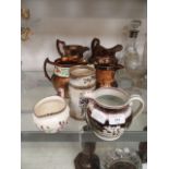 A collection of lustre ware and other jugs