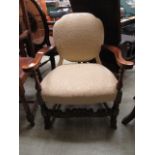 A Dutch style beech framed open armchair upholstered in a patterned white gold fabric