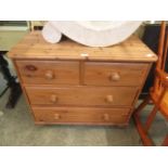 A wax pine chest of two short over two long drawers