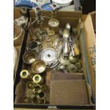 A tray containing assorted flatware, brass candle sticks, candelabra etc.