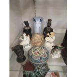 A selection of ceramic items to include African sitting figures, Staffordshire figures of sheep etc.