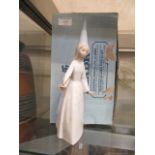 A boxed Lladro figurine of young girl with wand