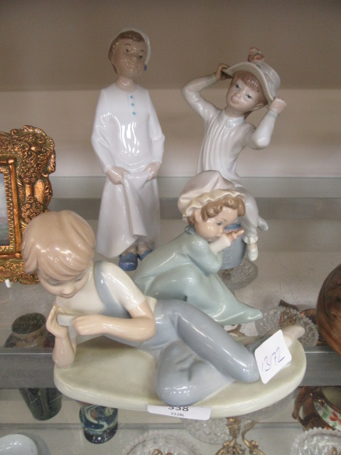 Four Nao and Lladro figures of young children