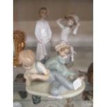 Four Nao and Lladro figures of young children