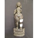 A carved Indian wooden figure