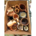 A box containing an assortment of mid-20th century pouring jugs, vases etc.