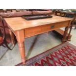 A early 20th century pine dining table having drawer to side CONDITION REPORT: