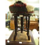 A late Victorian walnut piano stool