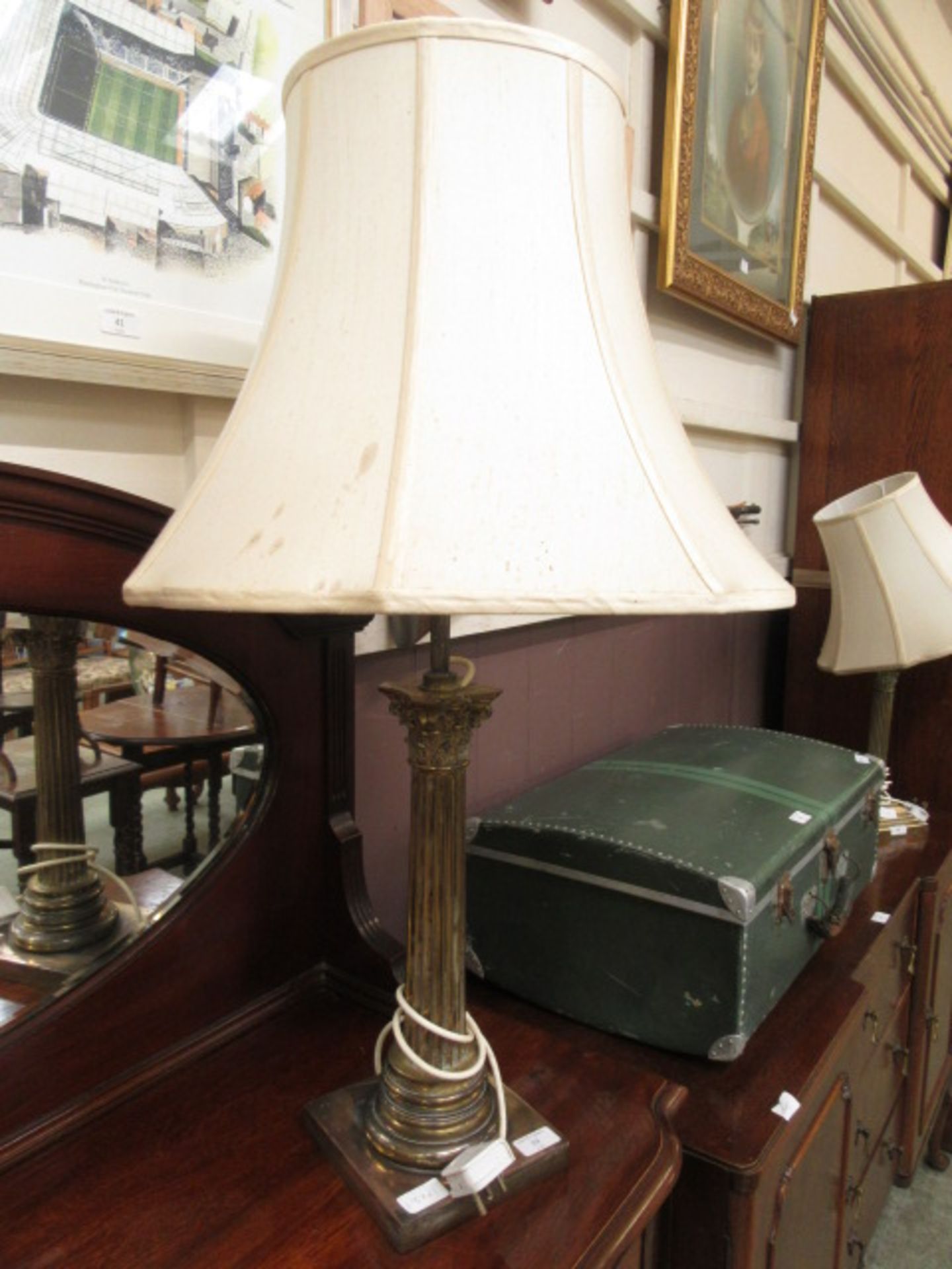 A brass effect table lamp with Corinthian column