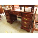 A mahogany effect twin pedestal desk