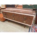 A mid-20th century walnut effect sideboard having six short drawers to base