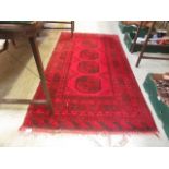 A mid-20th century red ground rug