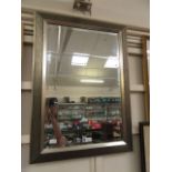 A silver framed bevel glass mirror