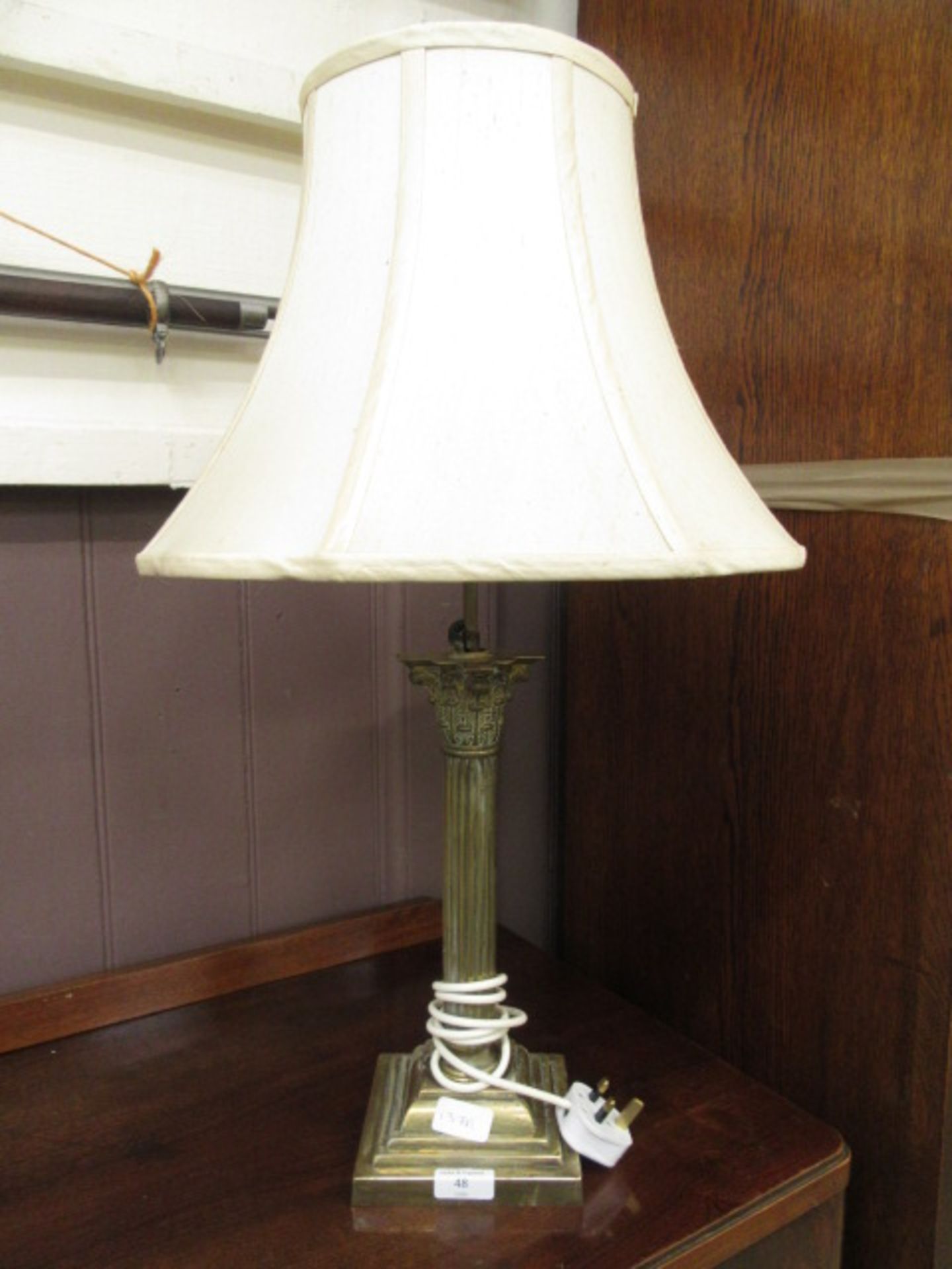 A brass Corinthian columned table lamp