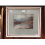 A framed and glazed pastel of lake scene signed Thomas Bradley